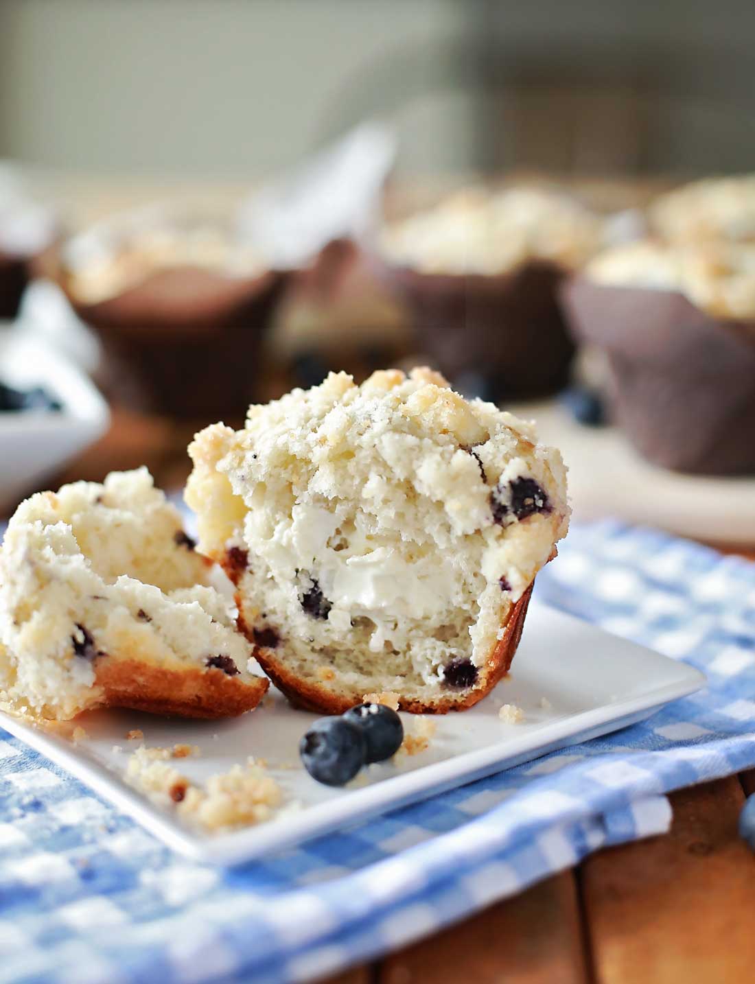 Blueberry Mufins with cream cheese and topped with streusel by Flirting with Flavor