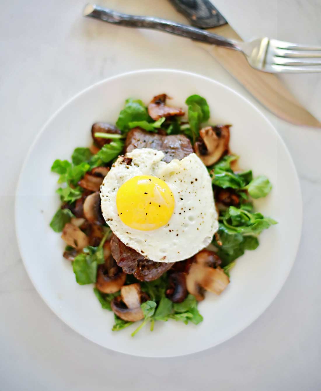 Steak and Eggs on a mushroom watercress salad!