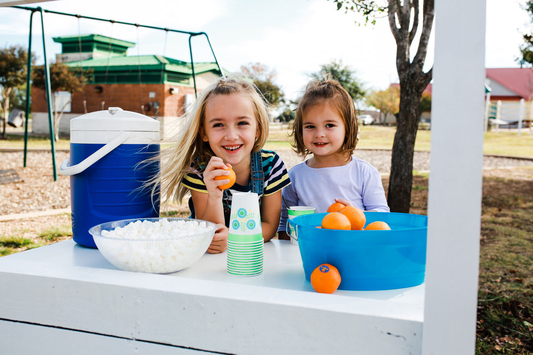 Cuties and hot cocoa stand. spreading sunshine