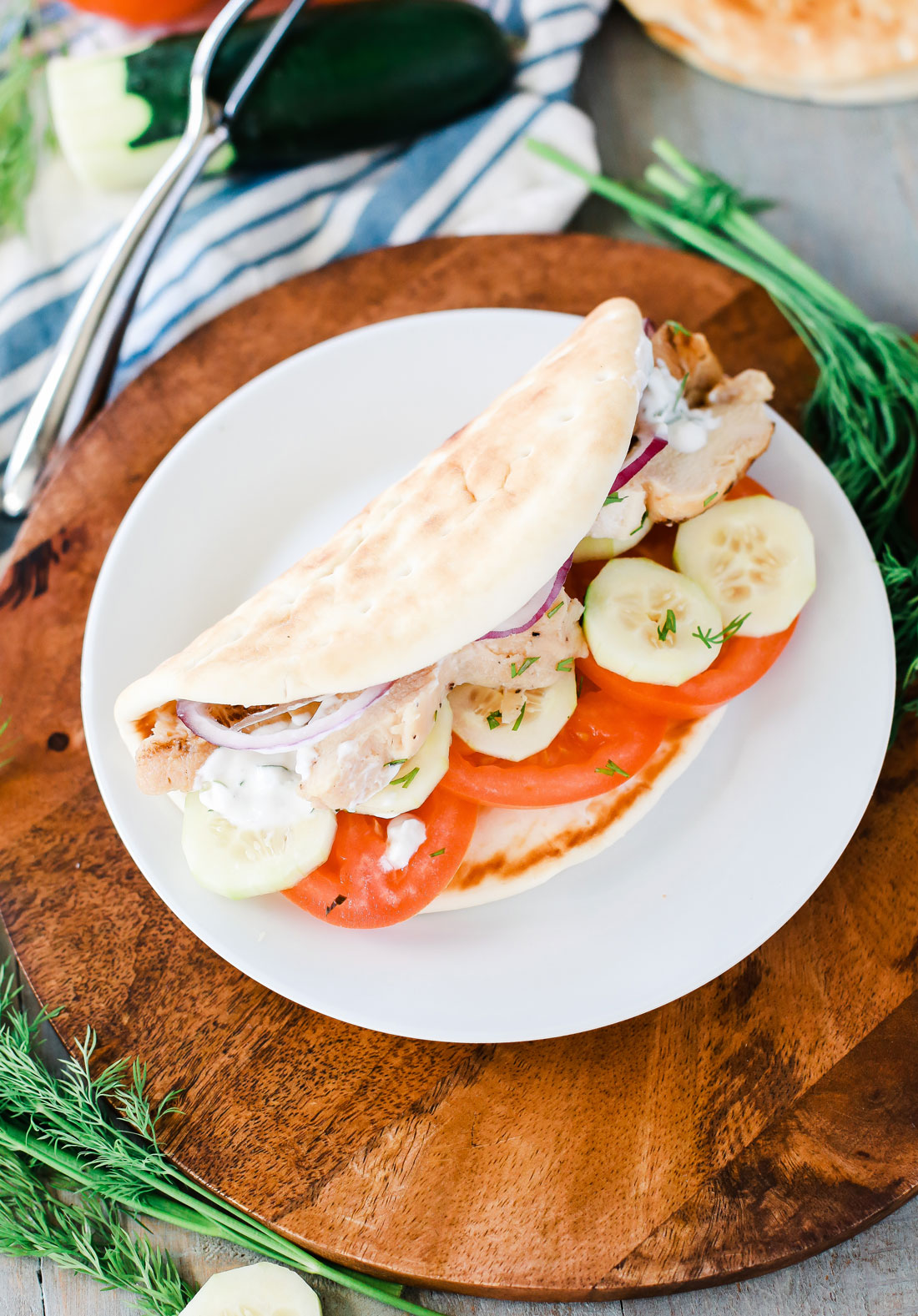 Greek Pita's stuffed with grilled chicken, tomatoes, red onion, cucumber and the best light and refreshing homemade Tzatziki.